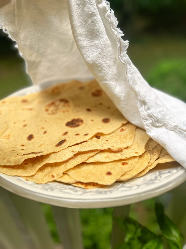 platter of homemade tortillas outside