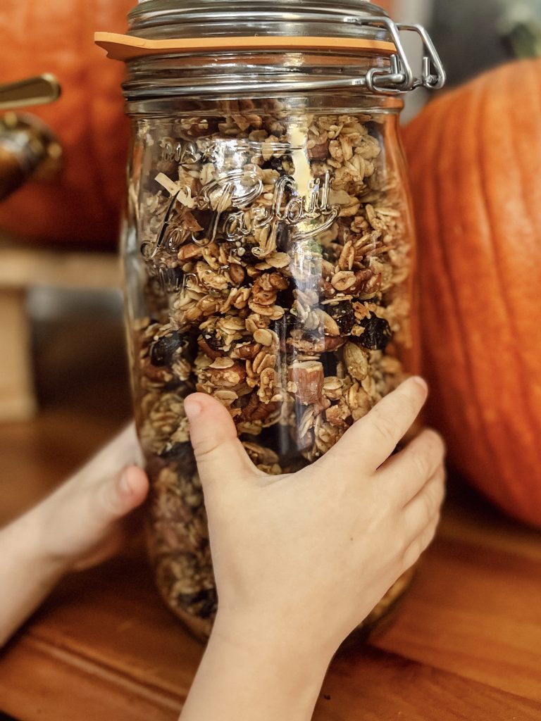 little kid holding granola